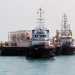 Tugboats position an SPM pump in the Basra Gulf in January 2012 as Iraq expands its export capacity. (ALI ABU IRAQ/Iraq Oil Report)