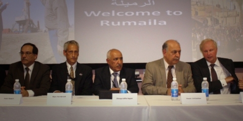 Officials from the Iraqi government and BP sign a newly amended contract for the development of the Rumaila oil field on Sept. 4, 2014. From left to right: Falah al-Amri, the director general of SOMO; Marc Hornbrook, the General Manager of the Rumaila project for BP; Dhia Jaffar, the director general of SOC; Thamer Ghadhban, advisor to the prime minister; and Bob Dudley, the CEO of BP. (ALI ABU IRAQ/Iraq Oil Report/Metrography)